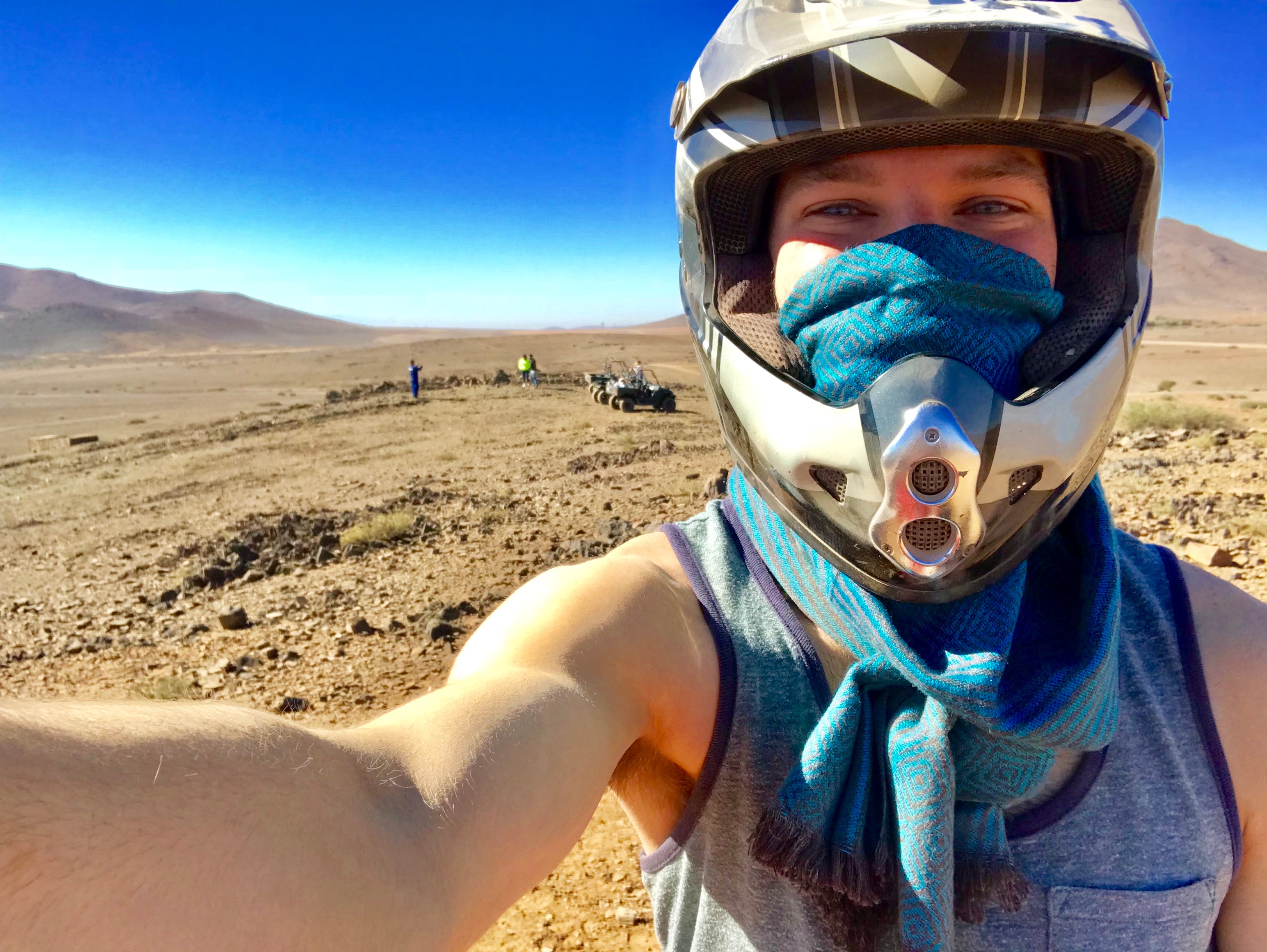 Student in desert wearing helmet