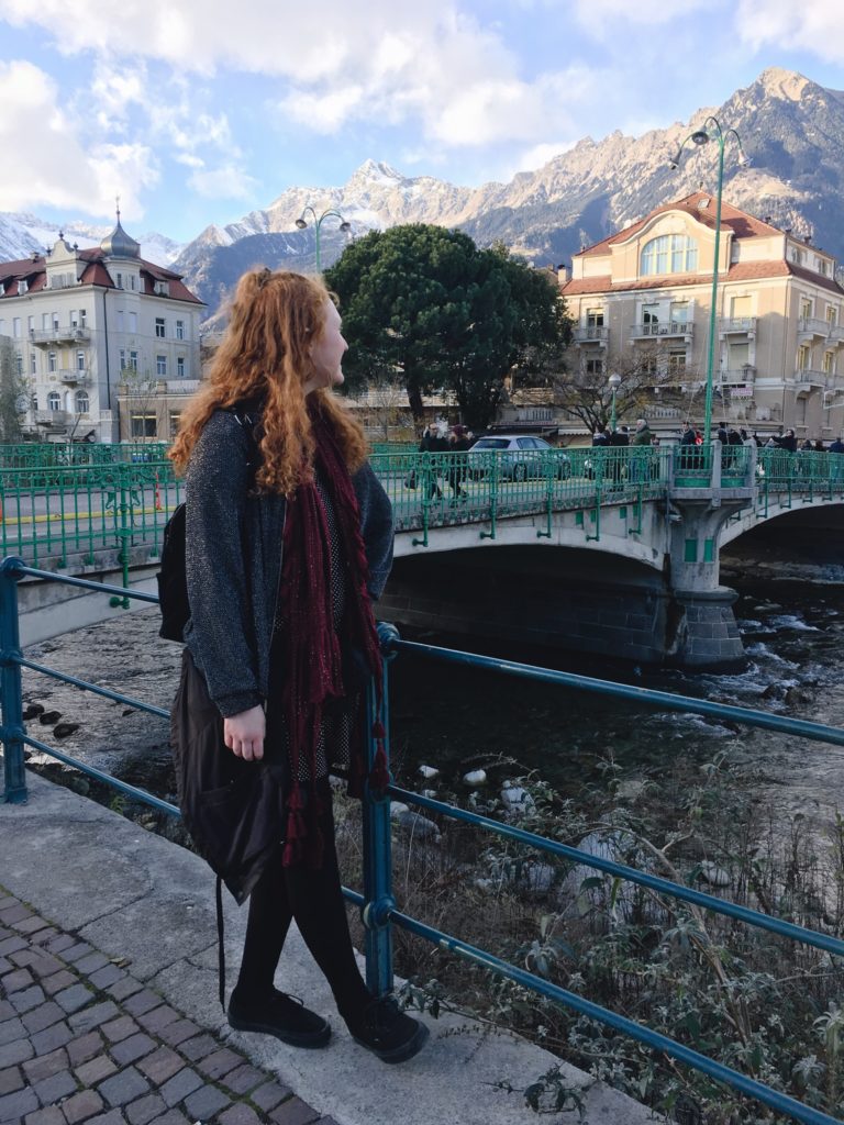 Student posing on the streets of Italy