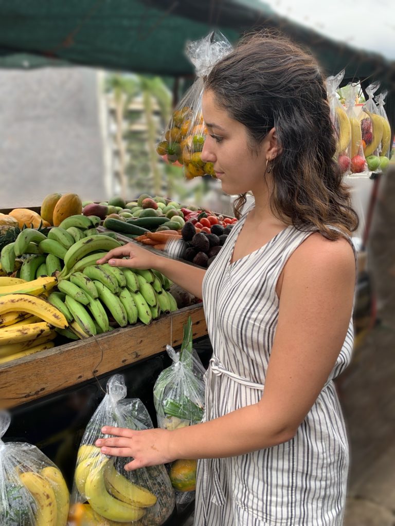Student buying fruits